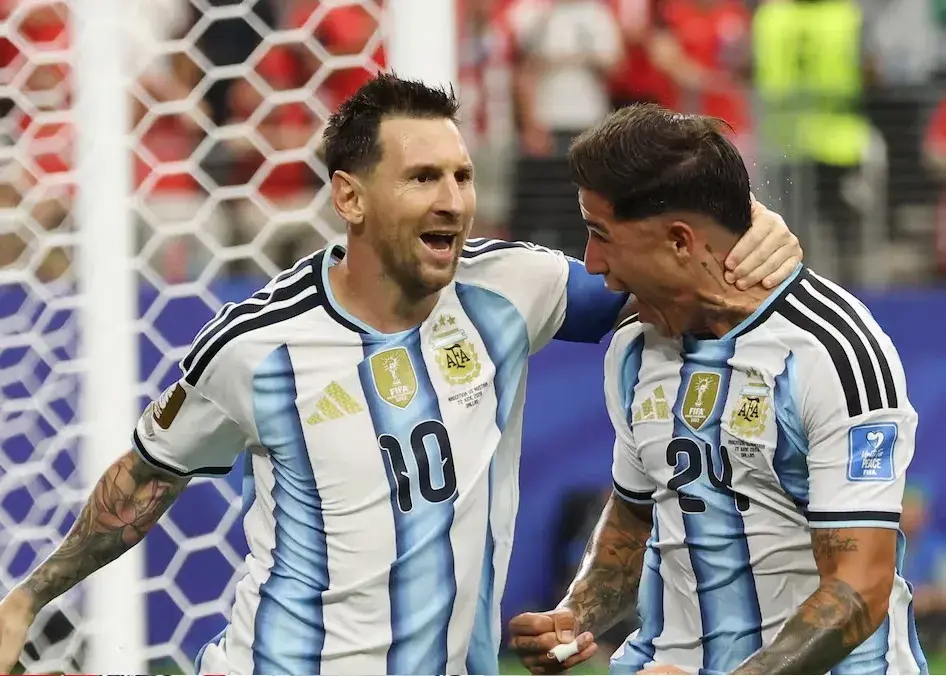 Messi double sends Argentina through and breaks World Cup scoring record