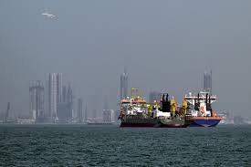 U.S. guides ships through Hormuz as UAE reports Iranian drone attack